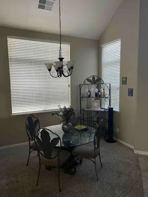 a dining room with a glass table and chairs at Furnished five bedroom and gated community in Patterson