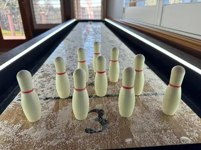 a group of white bowling pins in a game of bowling at On Golf Course, Family&Pet Friendly Yosemite Basecamp in Groveland