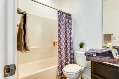 a bathroom with a toilet and a shower at Walk to Parks Mountain House Retreat with Patio! in Tracy