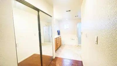 a bathroom with a mirror and a sink at New - Spacious, Comfortable 5 Beds 3 Baths House in Elk Grove