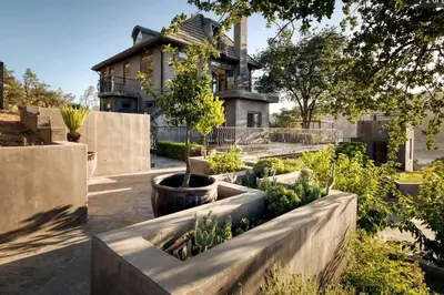 a house with a garden in front of it at Serene Millerton Lake Villa w/ Panoramic Lake View
