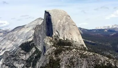 a large rock formation on top of a mountain at Mariposa Grove Creekside Retreat - To be featured on STAYCATION on the Destination Channel in 2026! in Fish Camp