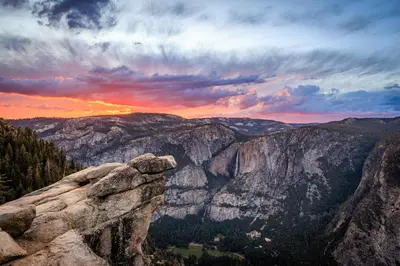 a view of a canyon at sunset at Mariposa Grove Creekside Retreat - To be featured on STAYCATION on the Destination Channel in 2026! in Fish Camp