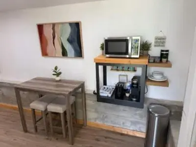 a room with a table and a table and a microwave at Lakeview Haven - Boat Slip - Dog Friendly - Sleeps 16