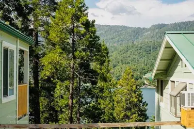 a house with a view of a lake and trees at Lakeview Haven - Boat Slip - Dog Friendly - Sleeps 16