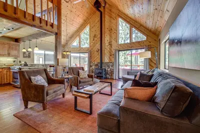 a living room with a couch and chairs in a house at 1 Mi to Tahoe Donner Skiing Luxe Truckee Cabin! in Truckee