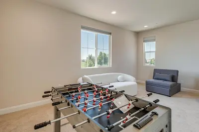 a living room with a large foos ball at Patio and Outdoor Kitchen Manteca Family Home in Manteca