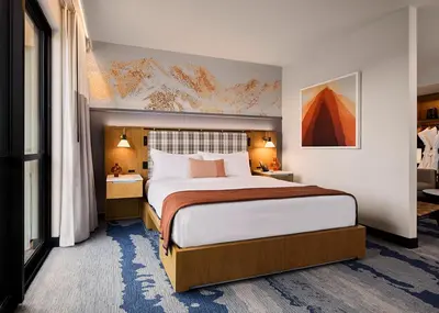 a bedroom with a large bed in a hotel room at Limelight Mammoth in Mammoth Lakes