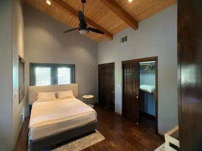a bedroom with a bed and a ceiling fan at Ranch Resort Suite Near Sequoias in Woodlake