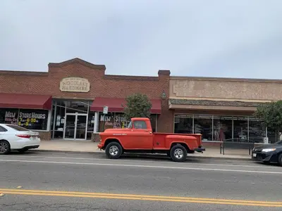 an old red truck parked on the side of a street at Ranch Resort Suite Near Sequoias in Woodlake