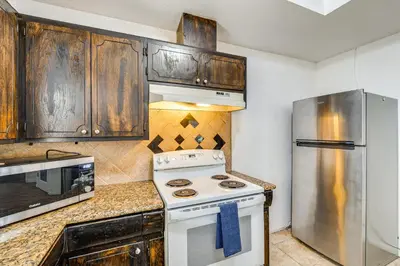 a kitchen with a stove and a refrigerator at Updated Home in Suburbs - 10 Mi to Dtwn Stockton! in Stockton