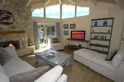 a living room with a couch and a fireplace at 2078 Traverse Court home in South Lake Tahoe