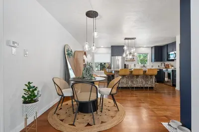 a kitchen and dining room with a table and chairs at Midtown Bungalow in Reno