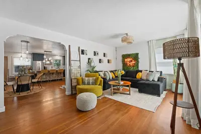 a living room with a couch and a table at Midtown Bungalow in Reno
