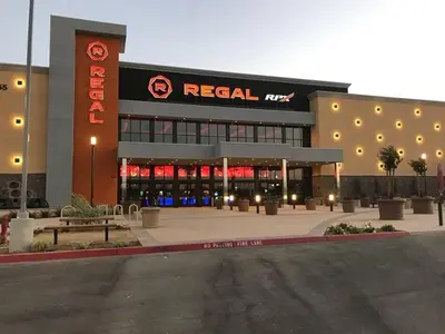 a retail building with a sign on the front of it at Cozy room at la paz in Fresno