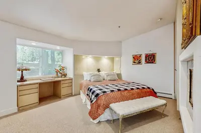 a bedroom with a bed and a sink and a window at Incline Village Retreat in Incline Village