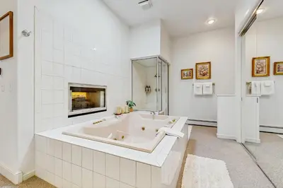 a white bathroom with a tub and a shower at Incline Village Retreat in Incline Village
