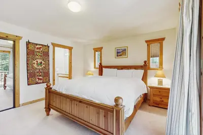 a bedroom with a bed and a window at The Tahoe House in Truckee