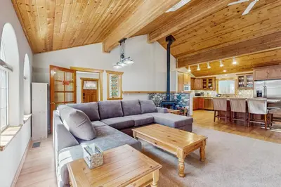 a living room with a couch and a table at The Tahoe House in Truckee