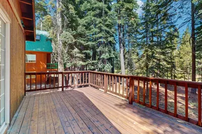 a wooden deck on the side of a house at The Tahoe House in Truckee