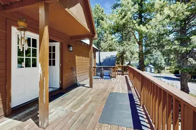 a wooden deck with a white door on a house at West End Escape in Truckee