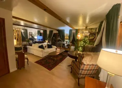 a large living room with couches and a table at Vintage Sunset Villa by Bass Lake 17 miles from Yosemite National Park in Oakhurst