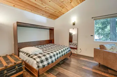 a bedroom with a bed and a large window at Private Lake Access Pet-Friendly Home in Arnold! in Arnold