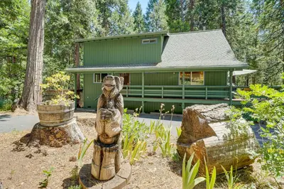 a home with a statue in front of a house at Private Lake Access Pet-Friendly Home in Arnold! in Arnold