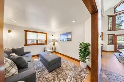 a living room with a couch and a table at Wintergreen at Tahoe Donner by Tahoe Getaways - 3BR w HOA! in Truckee
