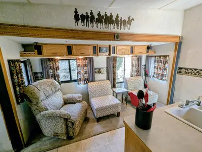 a living room with a couch and a chair at Sierra Escape RV in Squaw Valley