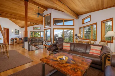 a living room with a couch and a table at Alpine Retreat By Hauserman Rentals in Tahoe City