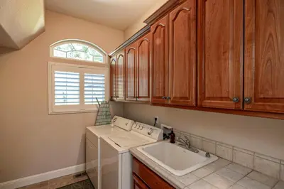 a kitchen with a sink and a white sink at Hemlock Hacienda in Groveland