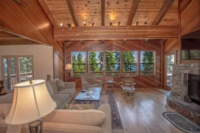 a living room with a couch and a fireplace at Big Pine By Hauserman Rentals in Tahoe City