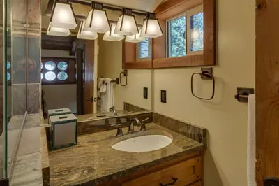 a bathroom with a sink and a mirror at Hoeck Hacienda By Hauserman Rentals in Tahoe City