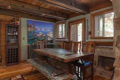 a dining room with a wooden table and chairs at Hoeck Hacienda By Hauserman Rentals in Tahoe City