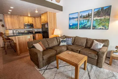 a living room with a couch and a table at Carnelian Woods #128 By Hauserman Rentals in Carnelian Bay