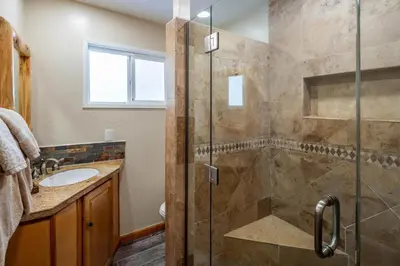 a bathroom with a shower and a sink at Catalpa Vista By Hauserman Rentals in Tahoe Vista