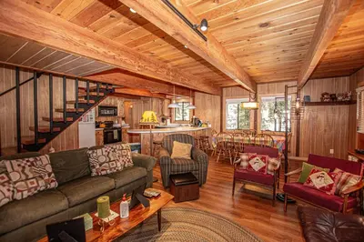 a living room with a couch and a table at Das Berghaus By Hauserman Rentals in Tahoe City