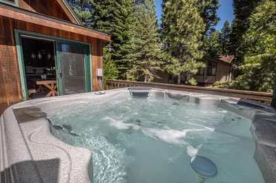 a hot tub in the backyard of a house at Edelweiss Escape By Hauserman Rentals in Tahoe City