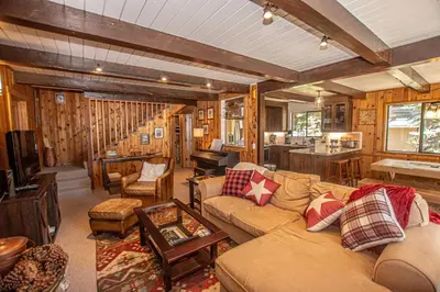 a living room with a couch and a table at Edelweiss Escape By Hauserman Rentals in Tahoe City