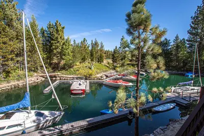 a group of boats are docked in a marina at Star Harbor # 27 By Hauserman Rentals in Tahoe City