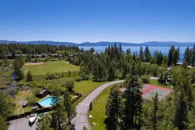 an aerial view of a park with a pool and a tennis court at Star Harbor # 27 By Hauserman Rentals in Tahoe City