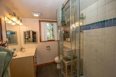 a bathroom with a shower and a toilet and a sink at Alpine Welcome By Hauserman Rentals in Tahoe City