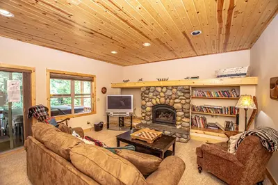 a living room with a couch and a fireplace at Tahoe Woods By Hauserman Rentals in Tahoe City