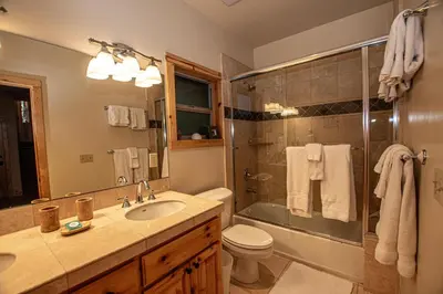 a bathroom with a toilet sink and a shower at Tahoe Woods By Hauserman Rentals in Tahoe City