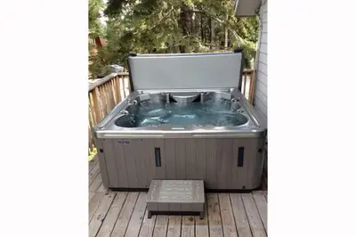 a hot tub sitting on a deck at Garret's Place By Hauserman Rentals in Tahoe City