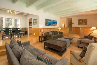 a living room with couches and a dining room at Dollar Point Lodge By Hauserman Rentals in Tahoe City