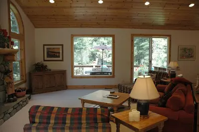 a living room with a couch and a table at Going By Hauserman Rentals in Homewood