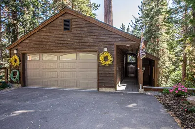 a house with a garage with areath on it at Black Bear Haus By Hauserman Rentals in Tahoe City