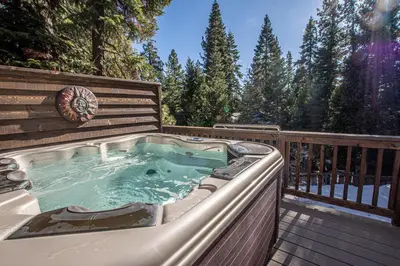 a jacuzzi tub on a wooden deck at Black Bear Haus By Hauserman Rentals in Tahoe City